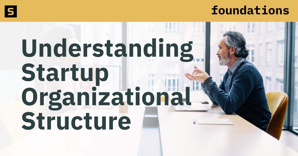 Man sitting at a conference table.