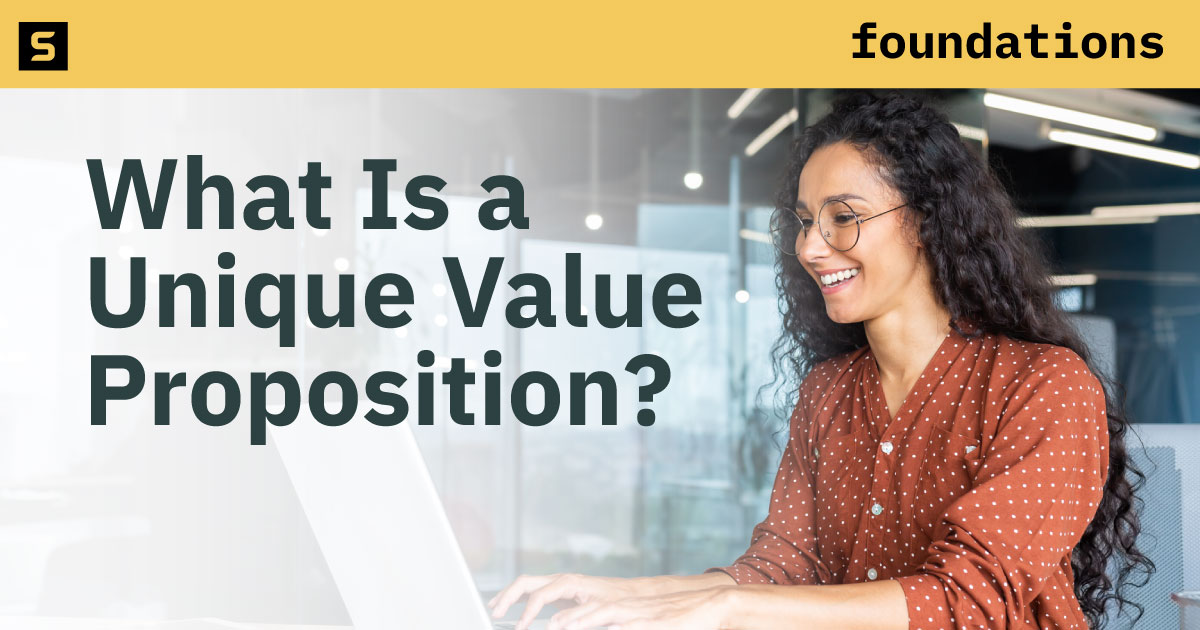Woman working to define her companies unique value proposition.