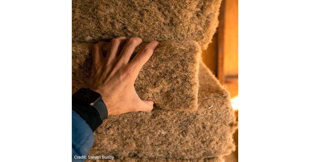 Hand touching HempWool.