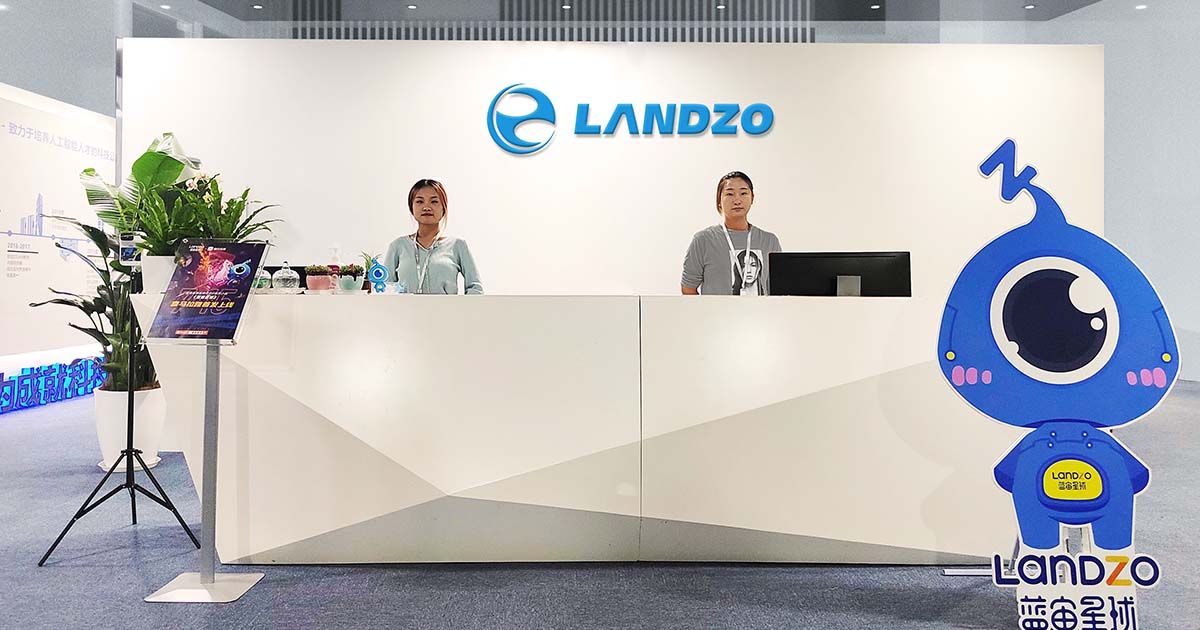 Landzo office with businesswomen at the front desk.