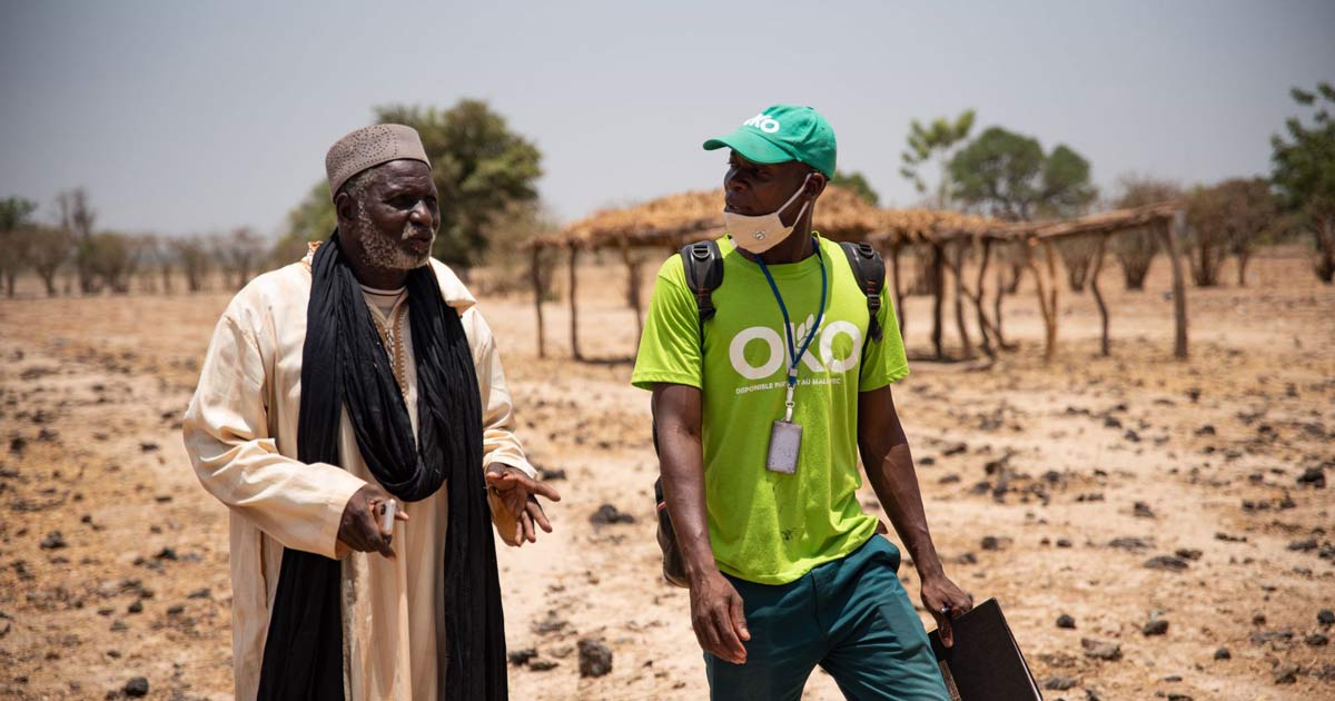 Man wearing OKO t-shirt.