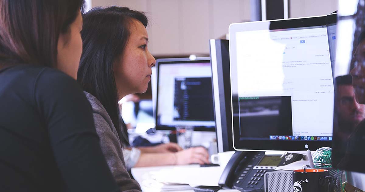 Women browsing a computer.